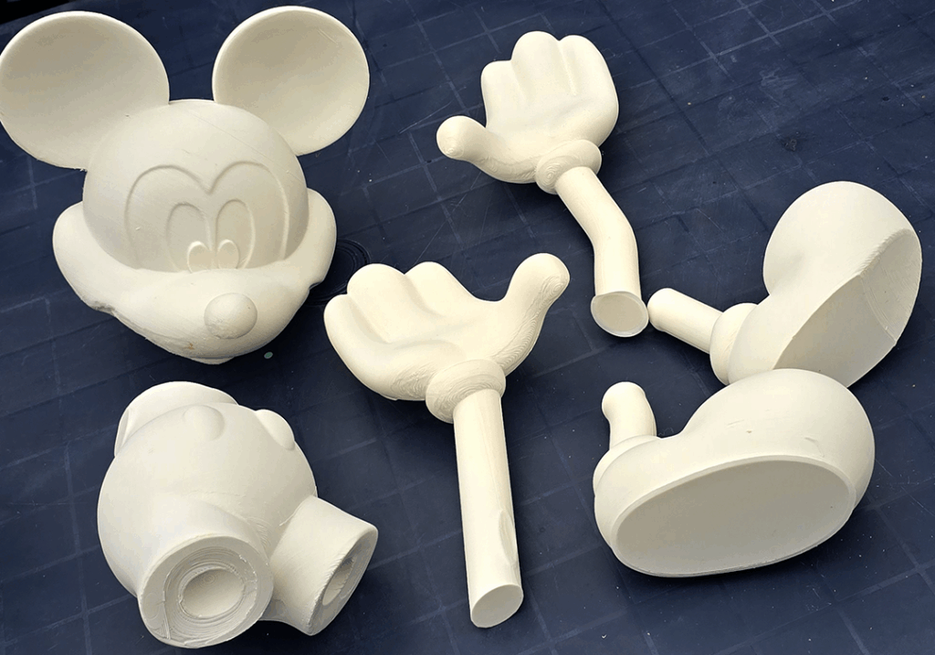 Cartoon-Figur in Einzelteilen